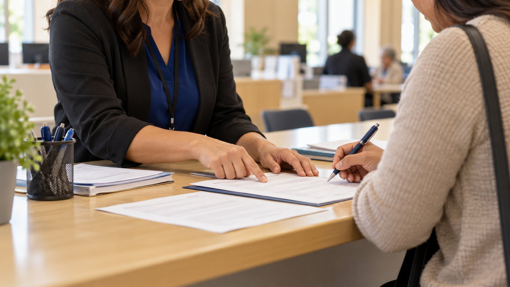 Court self-help staff member helps a visitor review family law forms.